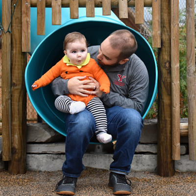Child and dad on gibbon slide