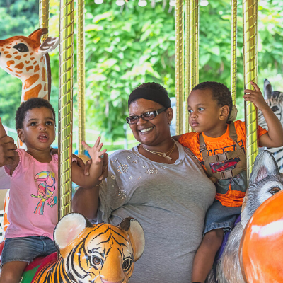 Mom and kids on carousel