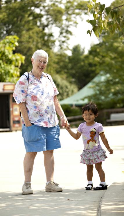 Grandmother and granddaughter holding hands