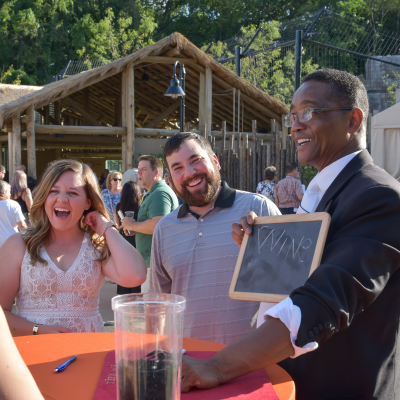 Magician with smiling guests