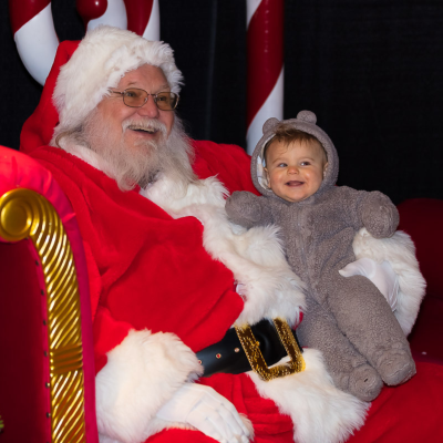 Santa with baby in bear pajamas