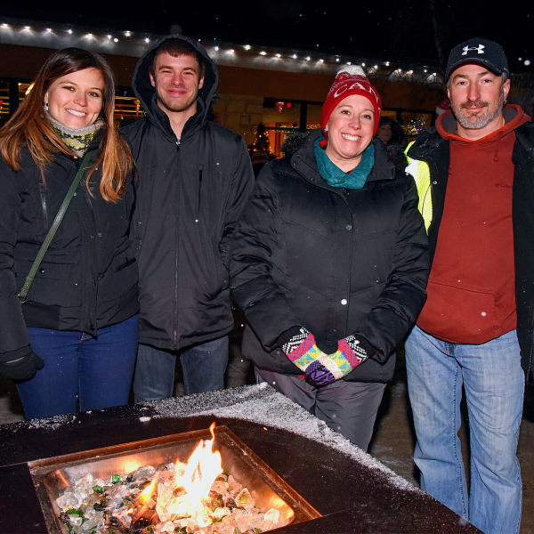 Family around outdoor firepit