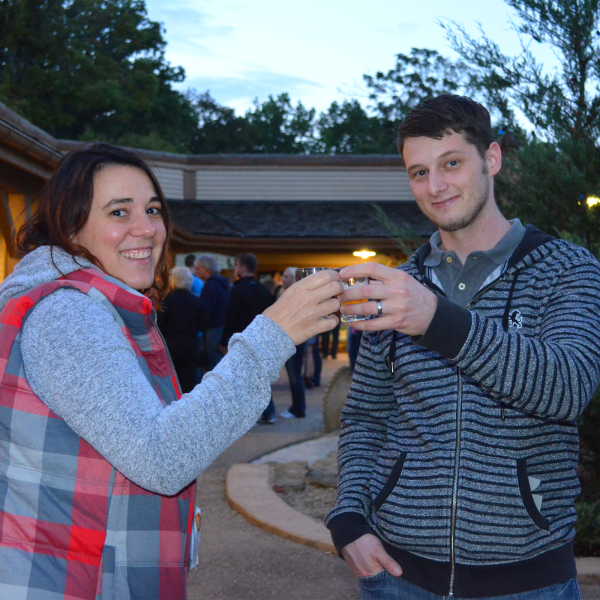 Woman and man toasting a drink