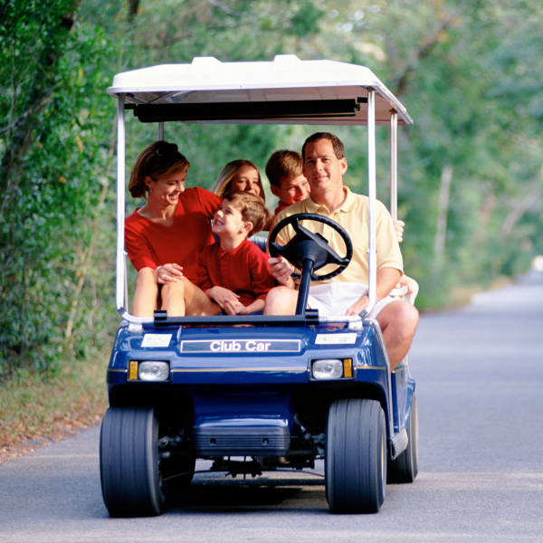 Family in golf cart